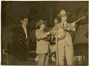 Roy Acuff, Bill Monroe (mandolin), and Bill Keith (banjo) performing at the Grand Ol' Opry