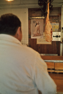 Hanging carcass in butcher shop