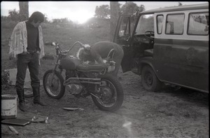 Two men working on motorcycle