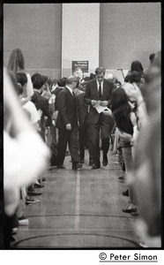 John Kenneth Galbraith (center right) walking up the aisle before introducing speech by presidential candidate Eugene McCarthy at Boston University