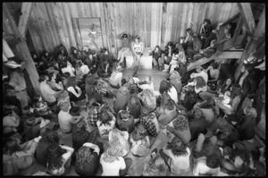 Michael Metelica addressing a crowd of commune members at a meeting inside the Brotherhood of the Spirit dormitory, Warwick, Mass. (view from above, front)