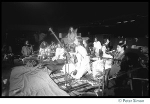 Bhagavan Das performing on stage (center) with Amazing Grace during the Ram Dass 'marathon'