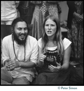 Couple watching Ram Dass at Sonoma State University