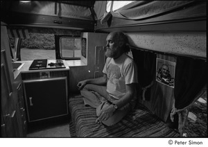 Ram Dass in his van: Ram Dass meditating next to a picture of Neem Karoli Baba