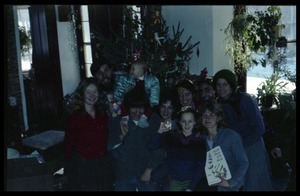 Communards and children posed in front of the Christmas tree, Montague Farm commune