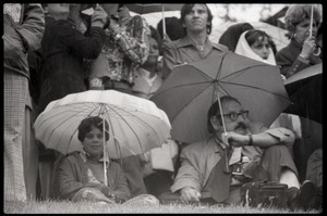 Close-up of crowd, with umbrellas, awaiting the arrival of Gerald Ford to dedicate the Old Great Falls Historic District as a national historic landmark