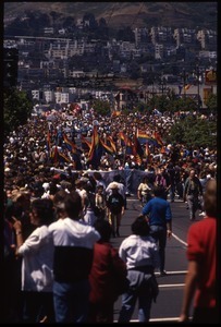 Massive crowd with pride flags marching in the San Francisco Pride Parade