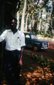 G. Robert standing next to a tree