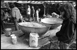 Preparing a meal under a makeshift shelter, Earth People's Park