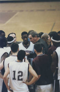 Coach Brock talking to players during a game (2000)