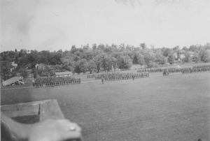 ROTC members in formation on a campus field