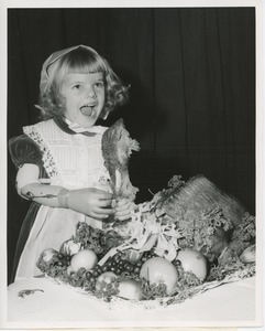 Little girl with turkey leg