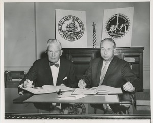 Presidents Bruce Barton of ICD and Carroll V. Newsom of NYU signing an affiliation agreement