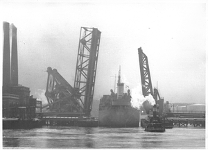 [View of the ship "Salem Maritime" and two tugboats passing through the Meridian Street Bridge]