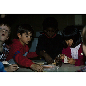 Young children seated at a table