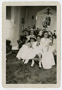 Children sitting in front of altar