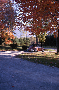 Red Convertible Volkswagen "Beetle" in the circular driveway of 336 Bulkley St. Williamstown, MA.