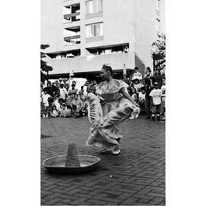 Girl dancing around a sombrero at the Festival Betances.