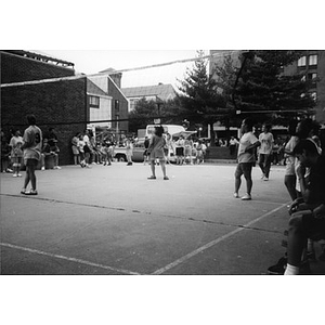 Women playing volleyball.