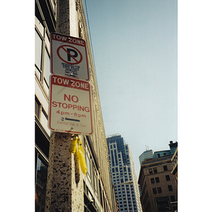 Two signs on a street in Chinatown / New England Medical Center campus