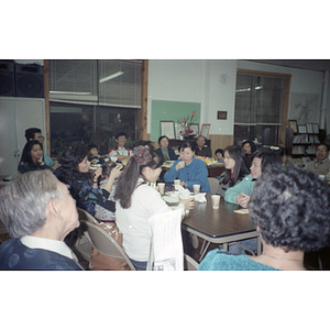 Adults and children attend a meeting of the Chinese Progressive Association