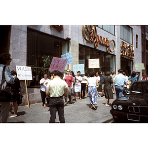 Protesters picket outside Dynasty Restaurant to get back wages for waiters