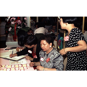 Welcome table at Chinese Progressive Association's 15th Anniversary Celebration