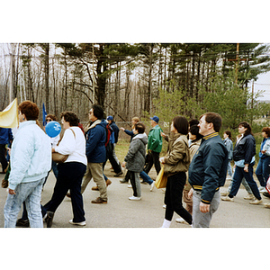 Profile of striking workers, unions, and members of the Chinese Progressive Association Workers' Center walk in the International Paper Company strike