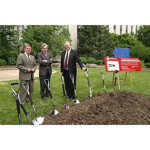 President Freeland, Neal Finnegan, and another man pose with the shovels for the groundbreaking of the Veterans Memorial