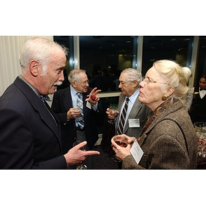 Professor William Fowler speaks with a guest at The National Council Dinner