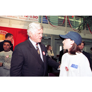 Senator Edward Kennedy speaking with a student at a financial aid rally