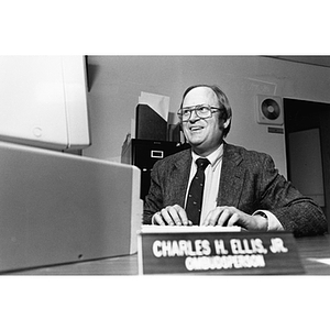 Charles Ellis, Associate Professor of Biology and Ombudsperson, sits at his desk