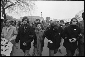 Five marchers, arms linked, protest the War in Vietnam during the Counter-inaugural demonstrations, 1969