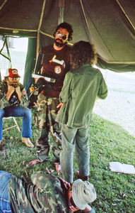 Gene Dorr speaking in a tent