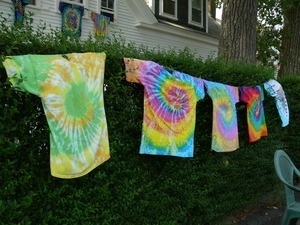 Tie dye t-shirts hanging on a line : Provincetown Carnival parade