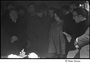 Jack Kerouac's funeral: mourners gathered around casket, Father Armand Morrissette (right)