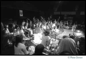 Bhagavan Das performing on stage (center) with Amazing Grace during the Ram Dass 'marathon'
