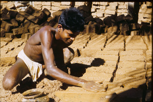 Making adobe bricks in South India