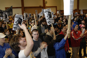 UMass student strike: strikers in the Student Union ballroom holding banner, signs, and cheering
