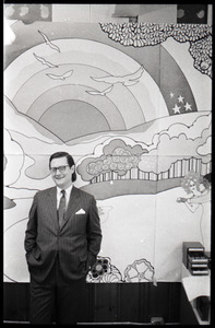Ray Riepen standing in front of a mural - Digital Commonwealth
