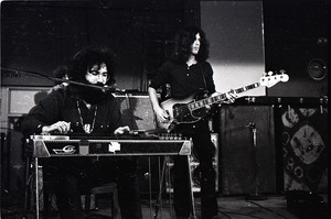 New Riders of the Purple Sage opening for the Grateful Dead at Sargent Gym, Boston University: Jerry Garcia playing a pedal steel guitar, Dave Torbert on right
