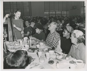 Susan Reed playing her harp at Thanksgiving