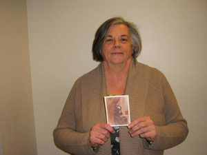 Virginia Wright holding a photograph of her grandmother Teresa Fegan Kelly