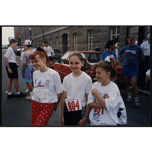 Three girls attend the Bunker Hill Road Race