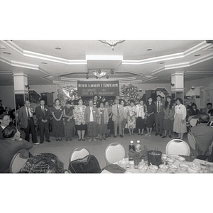 Guests standing at the Chinese Progressive Association's 15th Anniversary Celebration