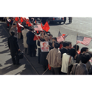 Crowd awaits the arrival of Chinese Premier Zhu Rongji at Boston Logan Airport