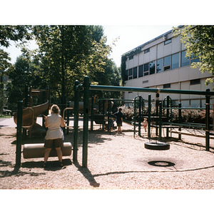 Woman playing with her child in a playground