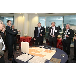 William Bartolini speaks to several men at the Veterans Memorial dinner