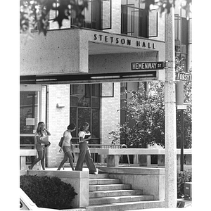 Three female students exit Stetson Hall