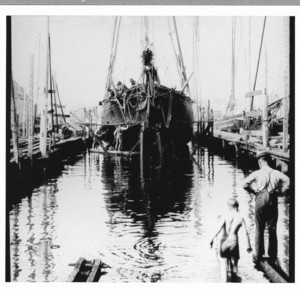 Marine railway with small schooner and boys, location unknown, undated